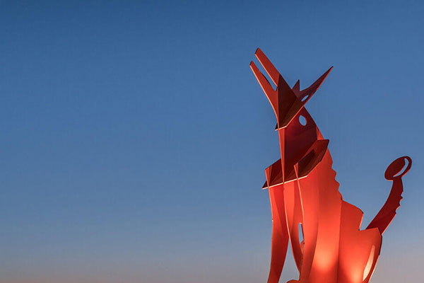 Coyote art structure at Haymoon Park at dusk within the Alamar community in Avondale, AZ