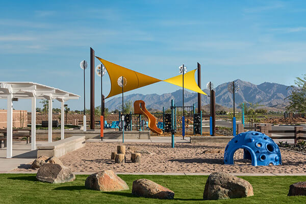 Stargaze Grove Park playground with sail shade at Alamar community in Avondale, AZ