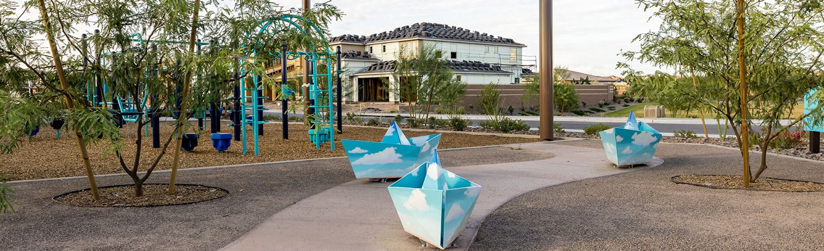 Journey Grove Park pathway with art at Alamar community in Avondale, Arizona