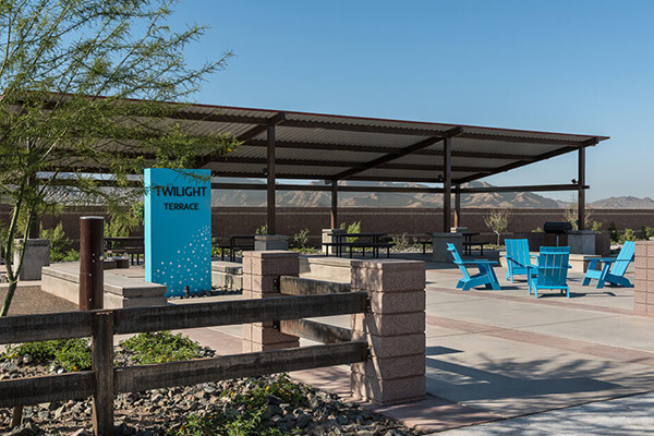 Twilight Terrace Park signage and seating area at Alamar community in Avondale, Arizona
