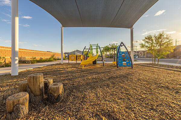 Drift Way Park playground with sail shade at Alamar community in Avondale, AZ